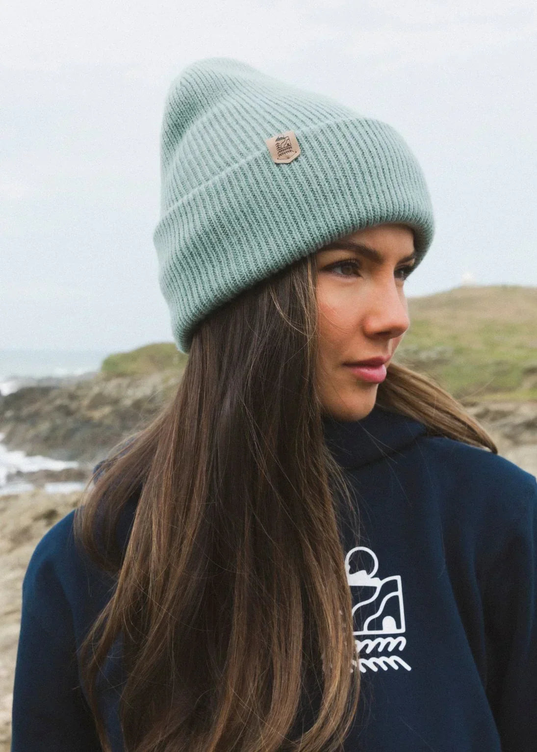 Eco-friendly mint beanie for surf, skate, and snow adventures by the coast