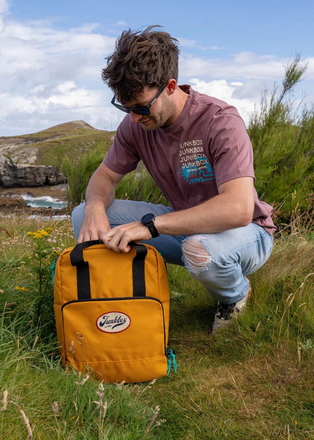 Man in outdoor setting with yellow backpack