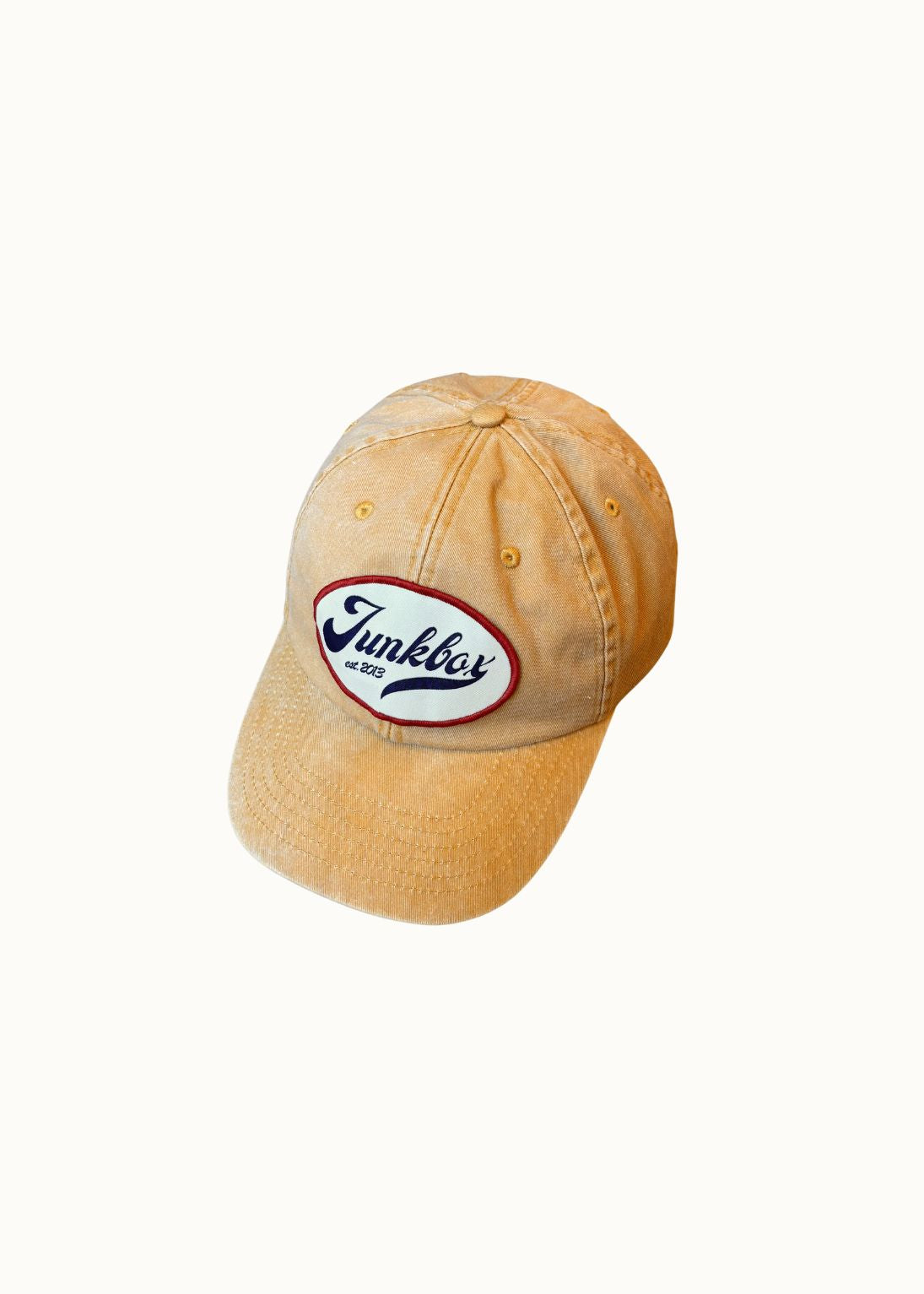 Mustard cap with a logo on a white background