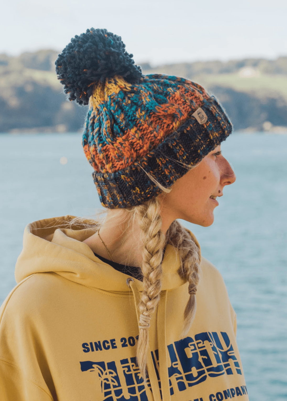 Explorer Pom Bobble Hat in Orange Blue Junkbox Apparel