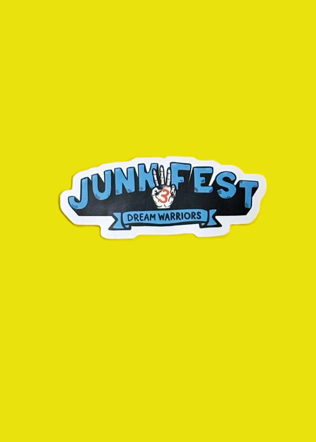 Sticker with 'Junk Fest Dream Warriors' text on a yellow background