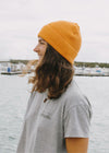 organic orange fisherman beanie hat side view 