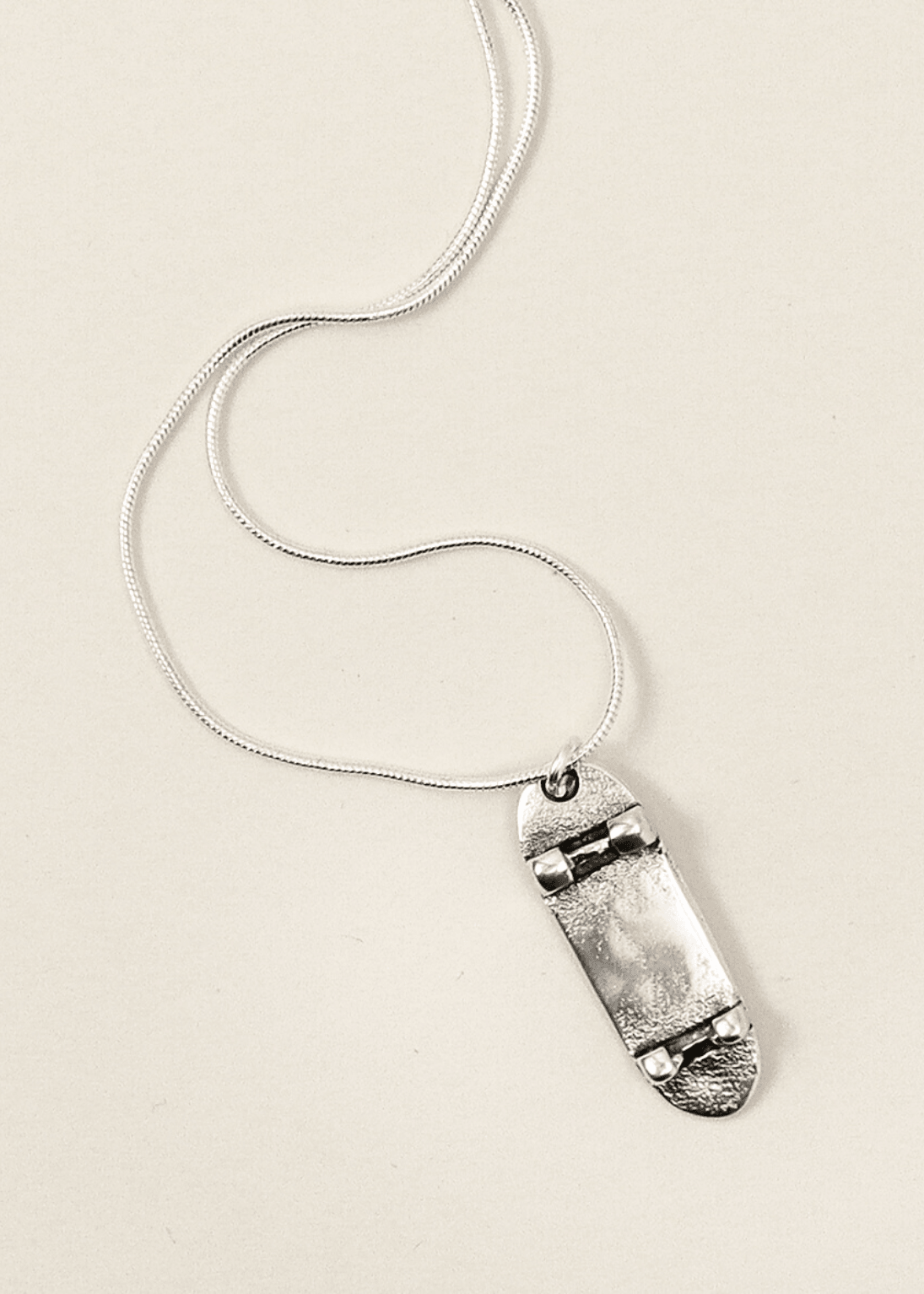 silver skateboard necklace